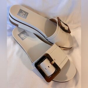 Dolce Vita Caster slide sandals in ivory with a tortoise-shell buckle